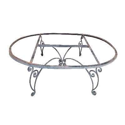 Mesa de centro oval en acero con soportes a manera de roleo