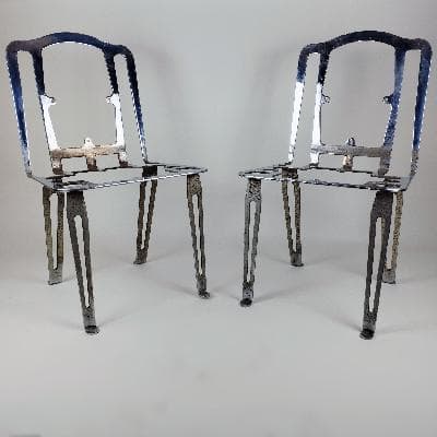 Juego de 5 sillas estilo Ramírez Vázquez en acero cromado, calado y doblado