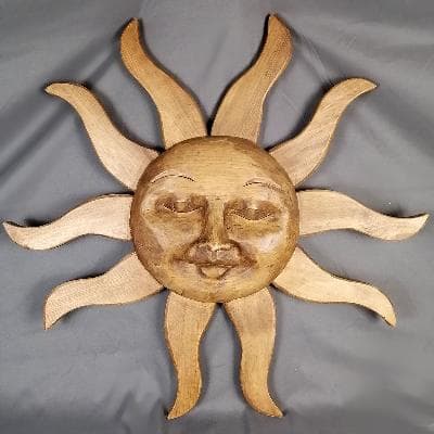 Sol. Escultura purépecha de pared madera.
