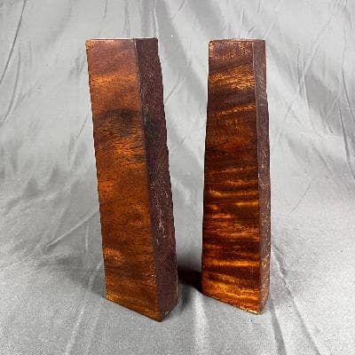 Par de sujetalibros en madera tropical